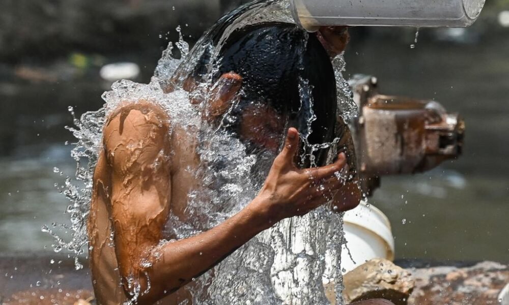 person drinking water hot summer sun dehydration india heatwave