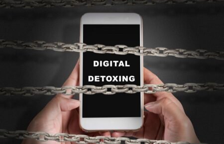 person putting phone away relaxing digital detox concept india