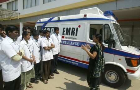 Ambulance vehicle outside a hospital during emergency healthcare operations in India.
