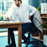 young adult unhealthy lifestyle stress work laptop junk food health risk