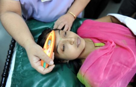 Doctors attending patients with seasonal viral infections in an Indian hospital