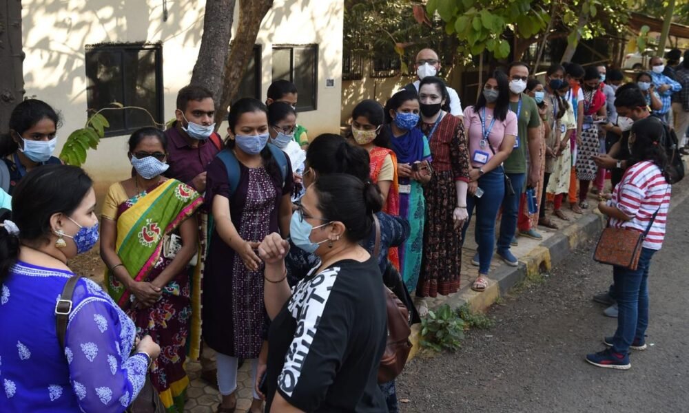 Healthcare workers conducting a vaccination awareness and outreach campaign in India.