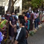 Healthcare workers conducting a vaccination awareness and outreach campaign in India.