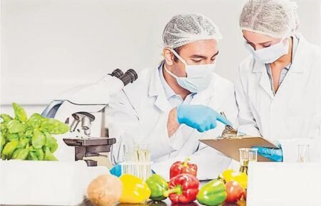 Food safety officer conducting hygiene inspection at a food establishment in India.