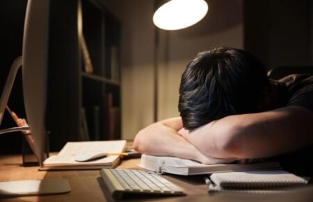 young adult using phone late night insomnia sleep deprivation india
