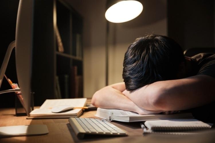 young adult using phone late night insomnia sleep deprivation india