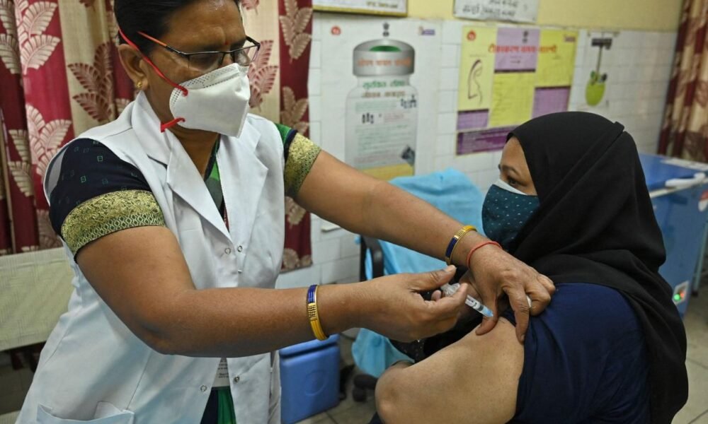 adult vaccination India doctor giving vaccine patient healthcare