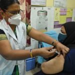 adult vaccination India doctor giving vaccine patient healthcare