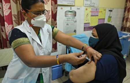 adult vaccination India doctor giving vaccine patient healthcare