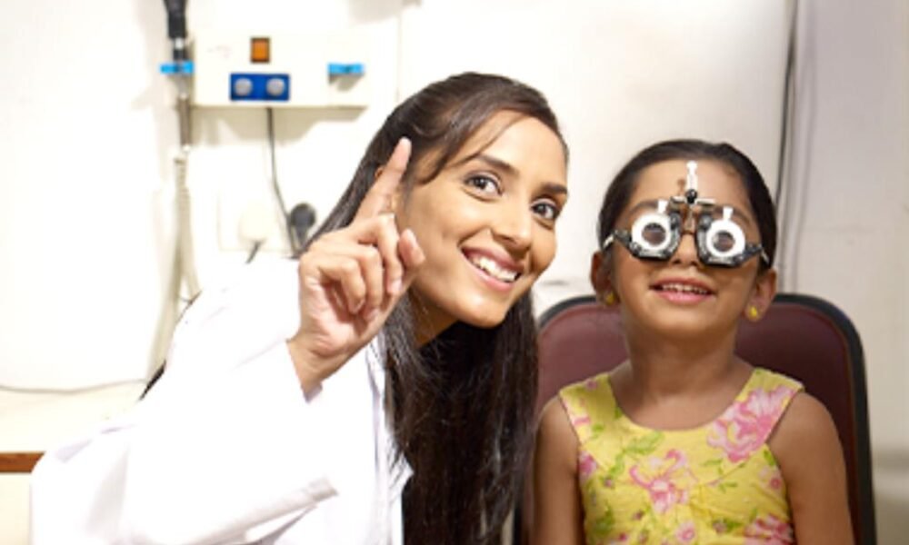 Eye doctor examining a child during a vision check-up in Telangana.