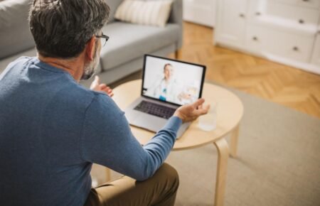 Doctor conducting a telemedicine consultation using digital healthcare technology in India.