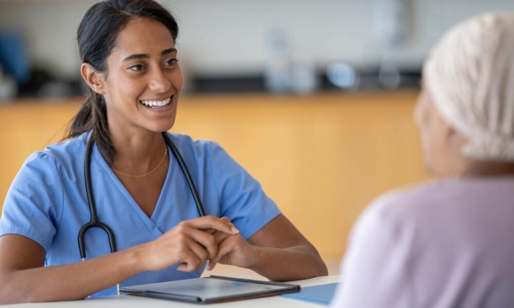 Healthcare professional conducting preventive cancer screening consultation.