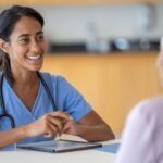Healthcare professional conducting preventive cancer screening consultation.