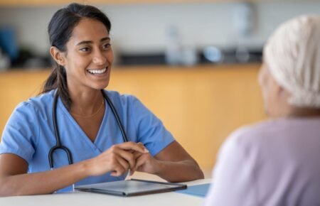 Healthcare professional conducting preventive cancer screening consultation.