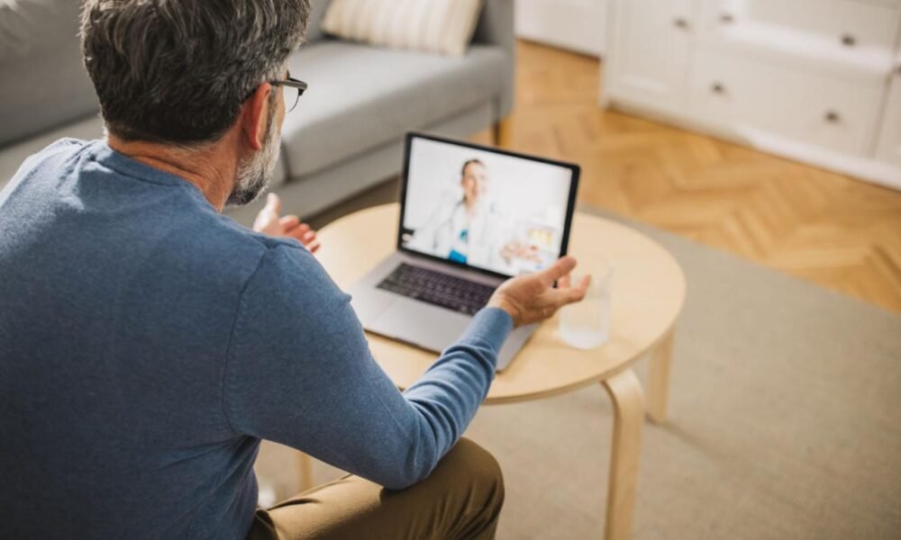 Doctor providing telemedicine consultation through a digital healthcare platform.