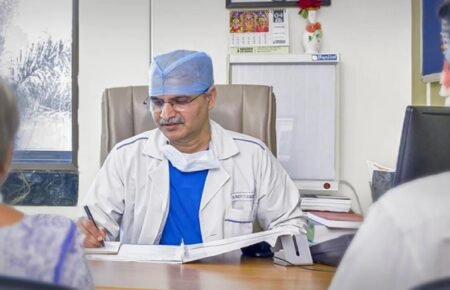 Doctor discussing heart health and preventive screening with a young adult patient.