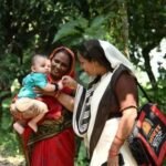Healthcare worker providing maternal and child healthcare services.