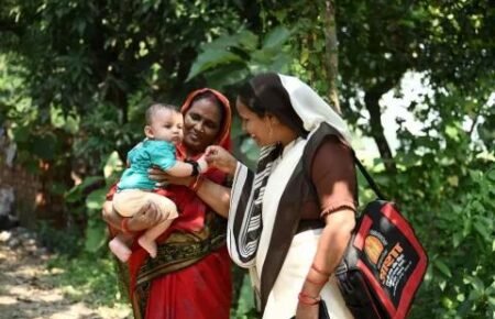 Healthcare worker providing maternal and child healthcare services.