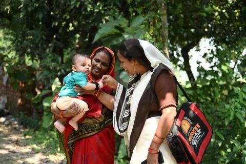 Healthcare worker providing maternal and child healthcare services.