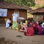 Health workers conducting awareness and disease prevention activities during the monsoon season.