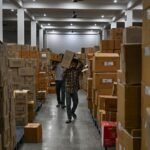 Pharmaceutical medicines stored in a warehouse for healthcare distribution.