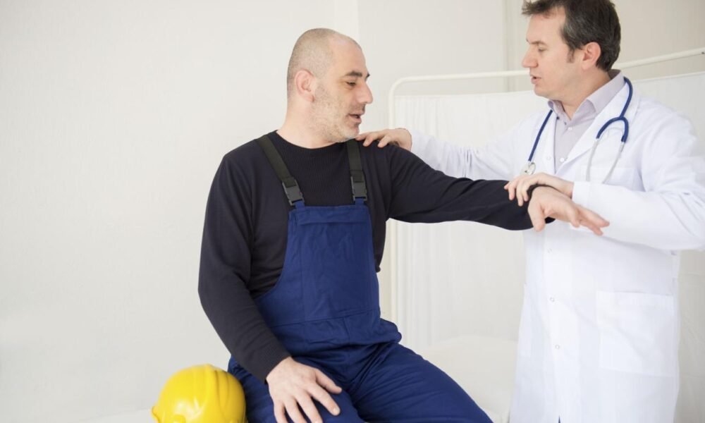 A doctor conducting a health check-up for construction workers at a medical camp.