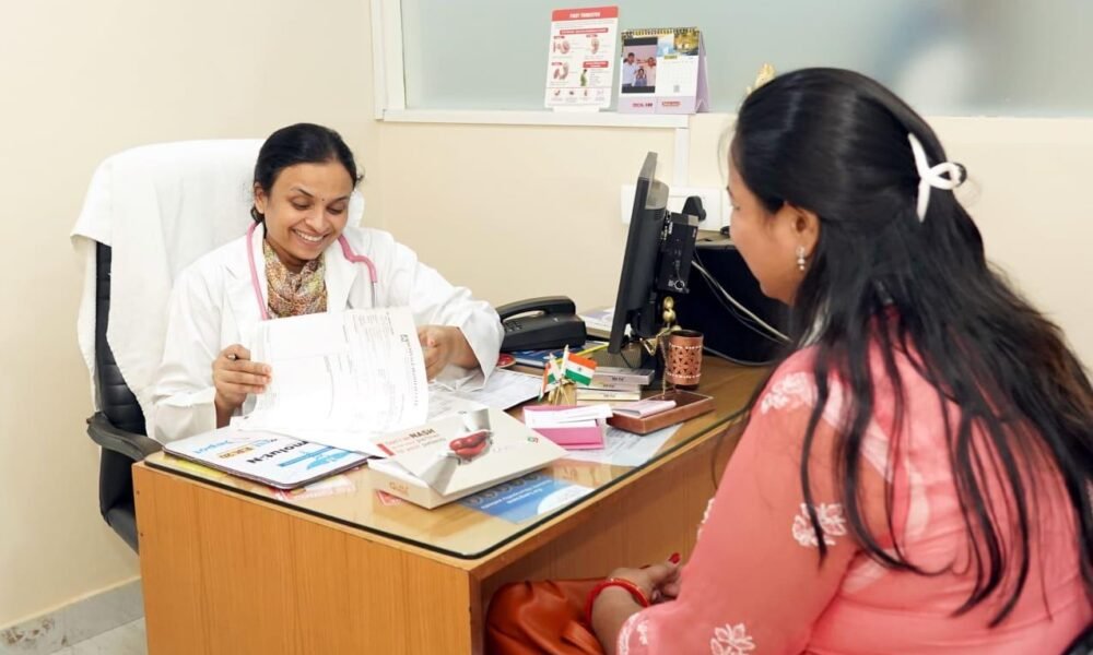 A female doctor conducting a health check-up for a woman at a government health centre.
