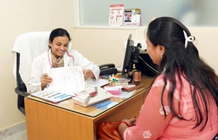 A female doctor conducting a health check-up for a woman at a government health centre.