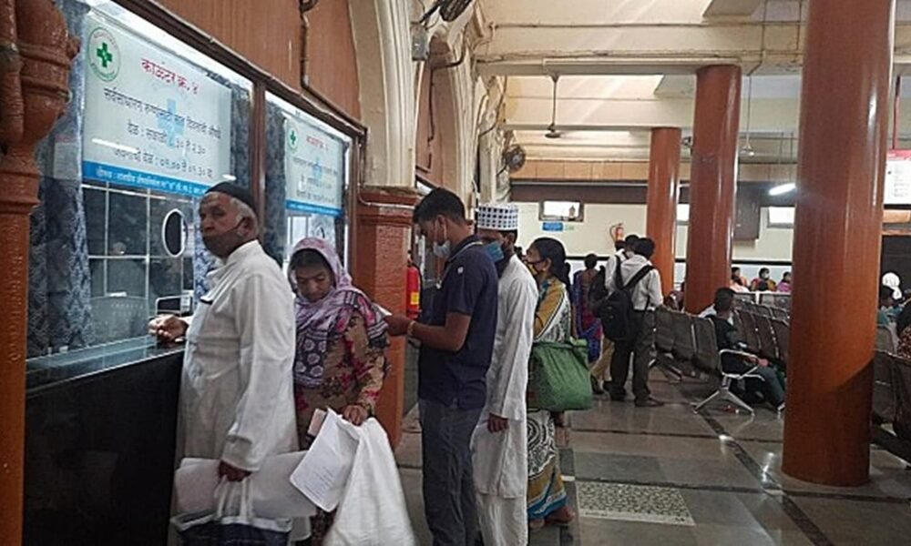Doctor using a digital health record system in a government hospital.