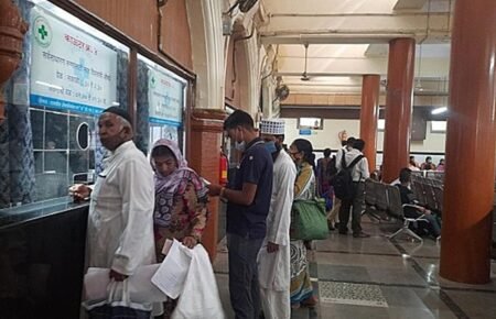 Doctor using a digital health record system in a government hospital.