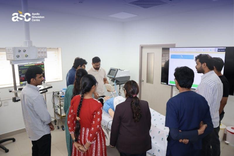 Medical students receiving hands-on training using a patient simulation mannequin.
