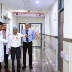 Engineers conducting a safety inspection inside a hospital building.
