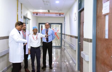 Engineers conducting a safety inspection inside a hospital building.