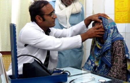 Doctors providing healthcare services at a government hospital under the National Health Mission.