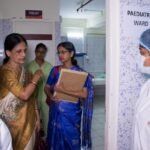 Nurses working together in a hospital after healthcare services resumed.
