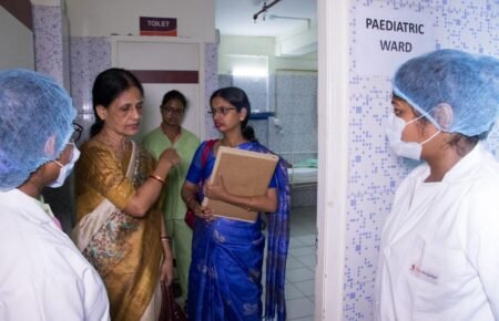Nurses working together in a hospital after healthcare services resumed.